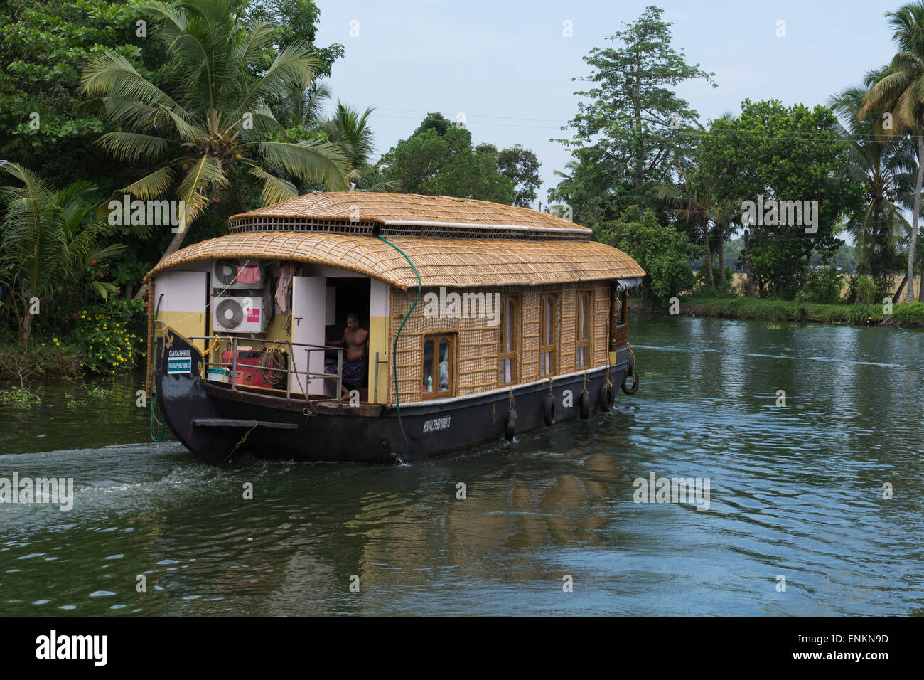 India, Kerala, Alleppey. Backwater canals of Kerala in the area of Kumarakom, known as the 'Venice of the East'. Houseboat. Stock Photo
