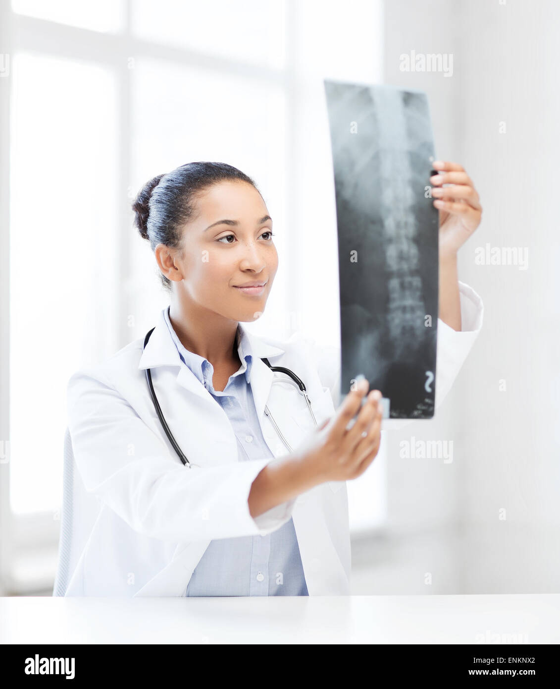 african doctor looking at x-ray Stock Photo - Alamy