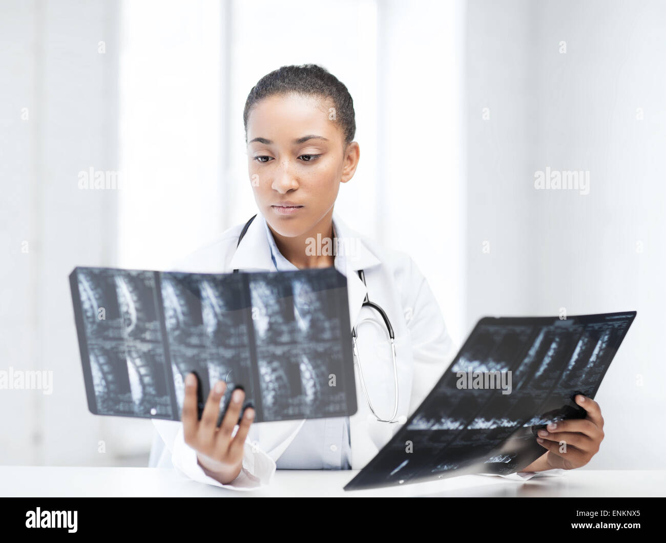 african doctor looking at x-rays Stock Photo - Alamy