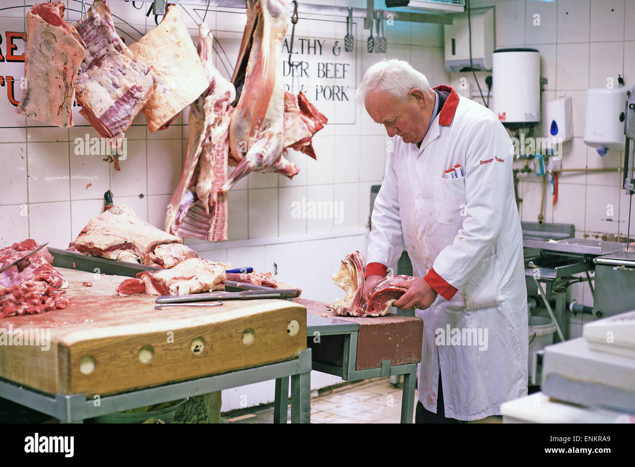 A butcher in the English Market in Cork city, Ireland Stock Photo