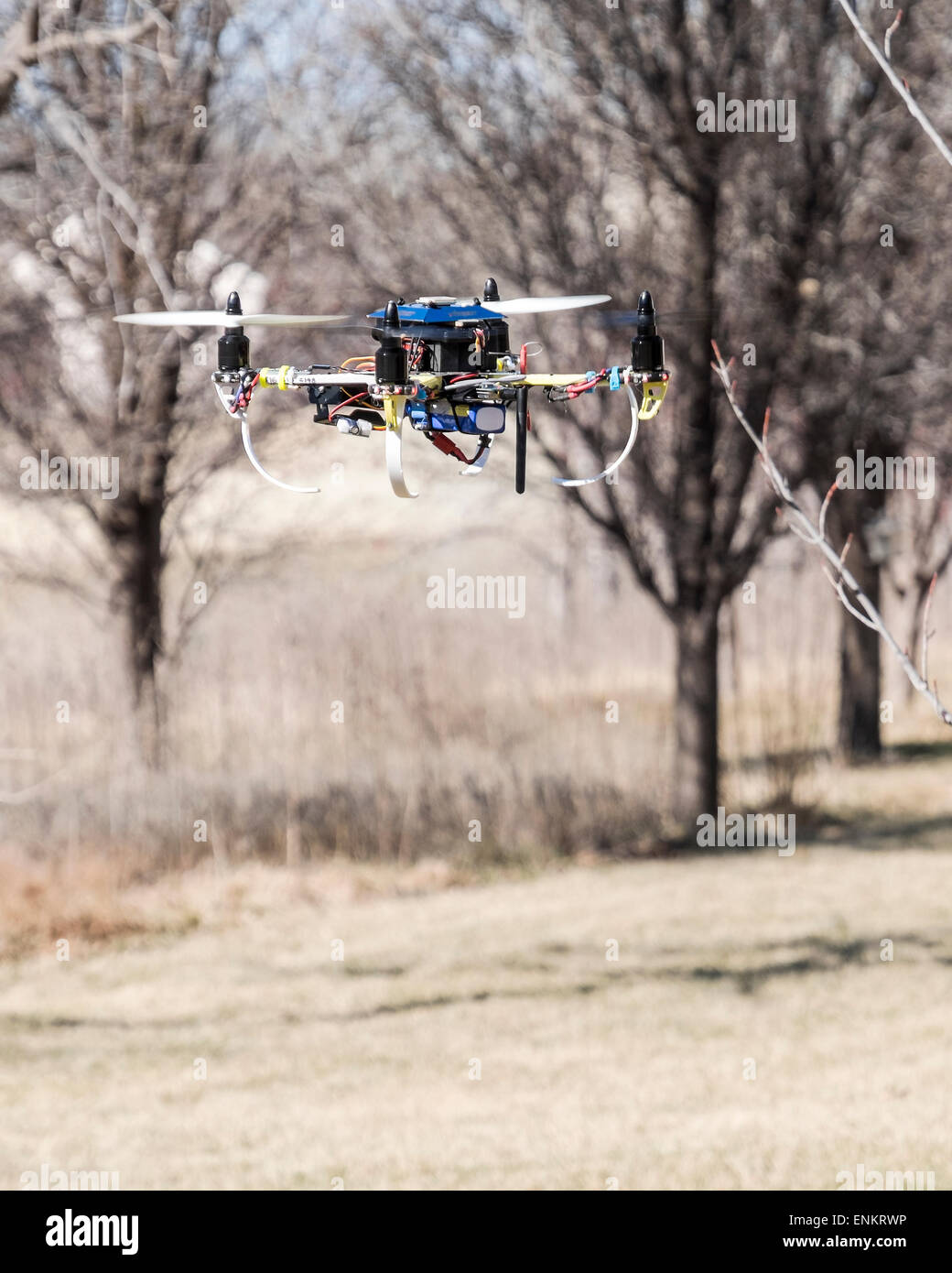 A home built Do It Yourself quad copter drone, flying. Stock Photo