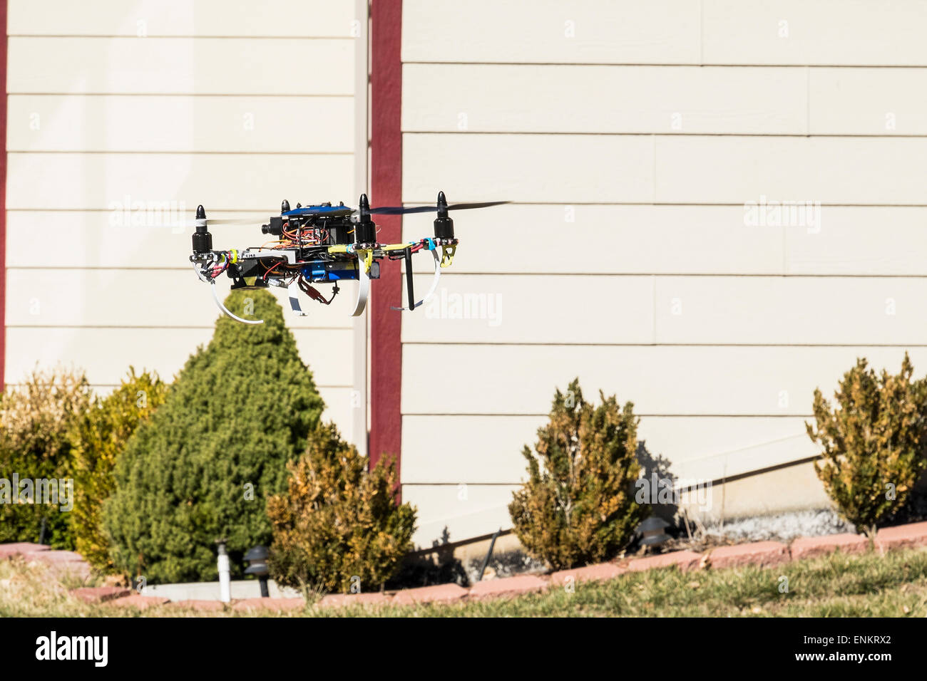 A home built Do It Yourself quad copter drone, flying. USA. Stock Photo