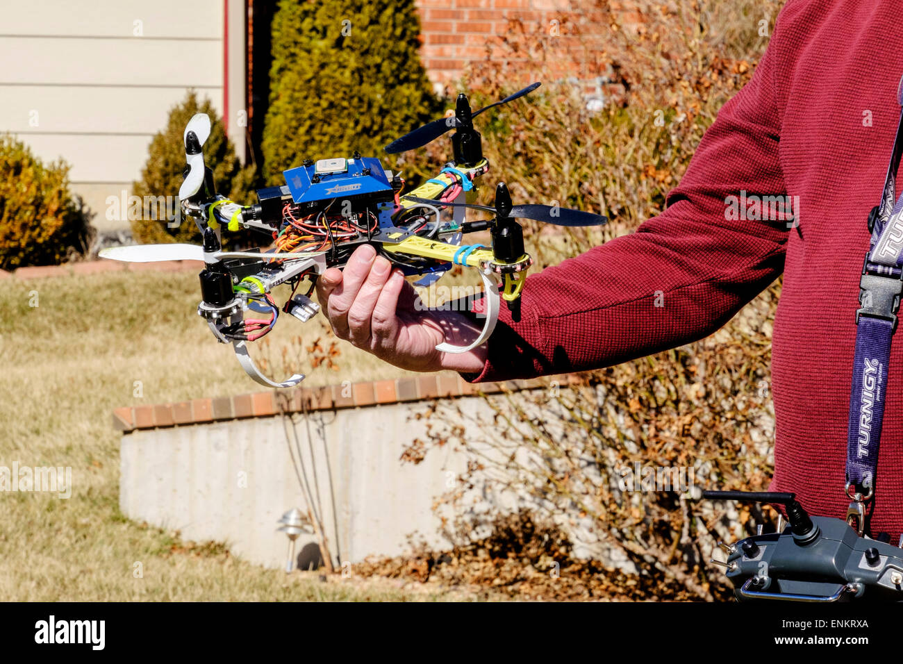 A 50 year old Caucasian man holds his DYI built quad copter. USA Stock Photo