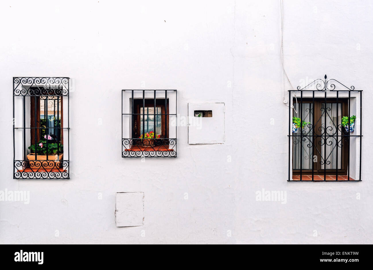 Windows with steel lattice on a whitewashed wall Stock Photo Alamy
