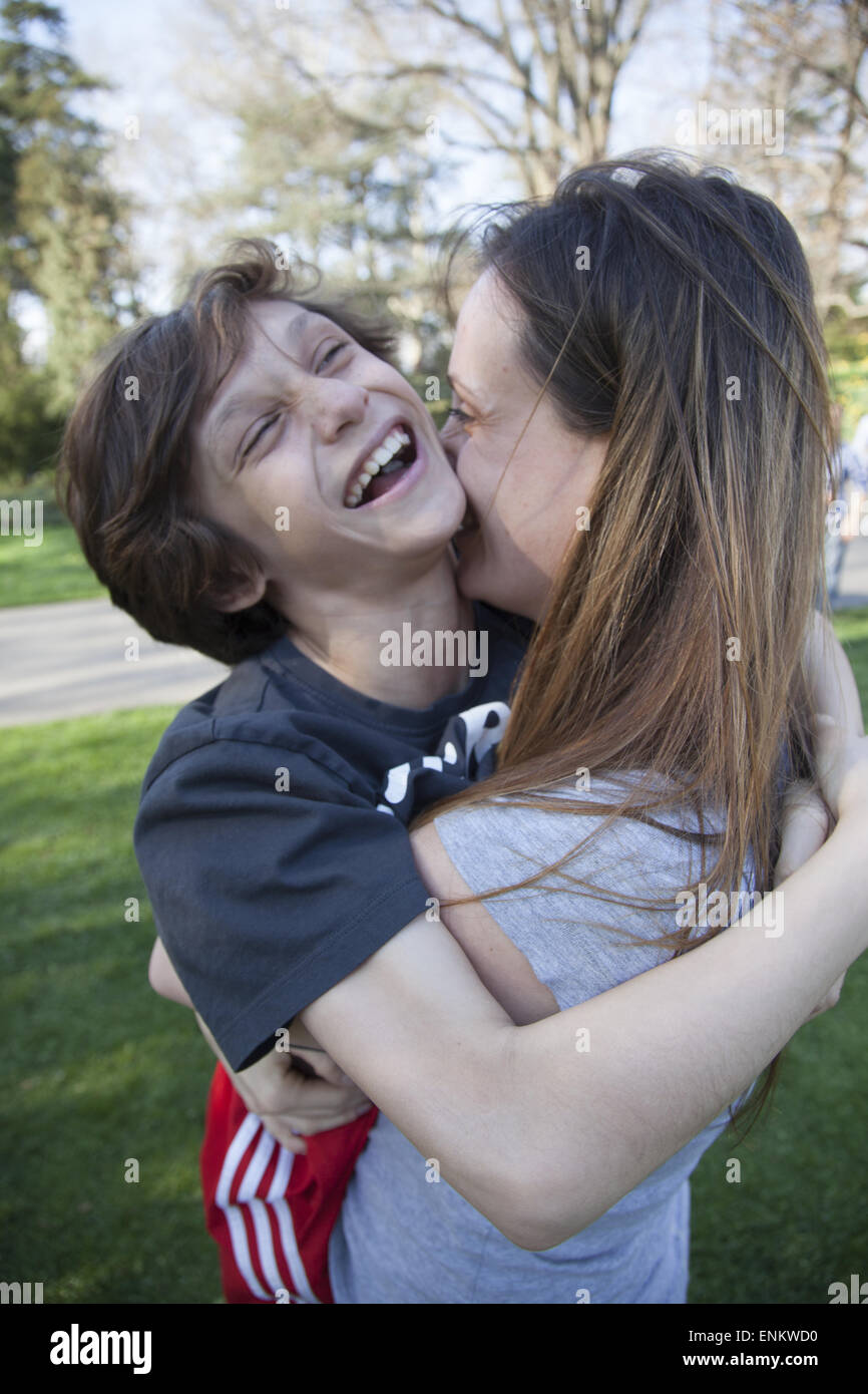 Ten year old boy having an affectionate moment with his mother Stock Photo  - Alamy