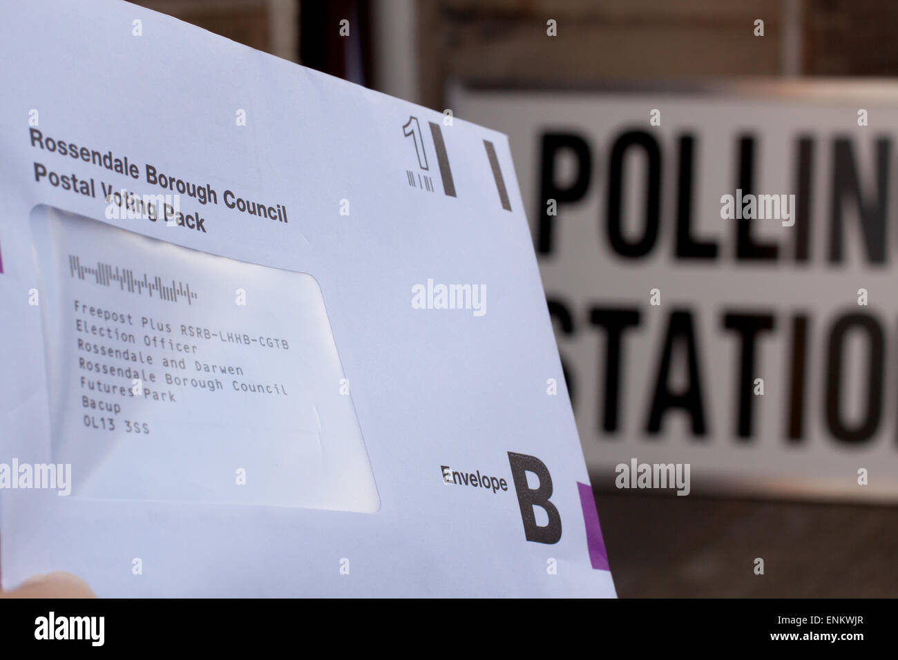 Darwen, UK. 7th May, 2015. A postal vote is hand delivered to a polling station for the Rossendale and Darwen constituency.  Polls suggest this is a marginal seat. Credit:  SCWLee/Alamy Live News Stock Photo
