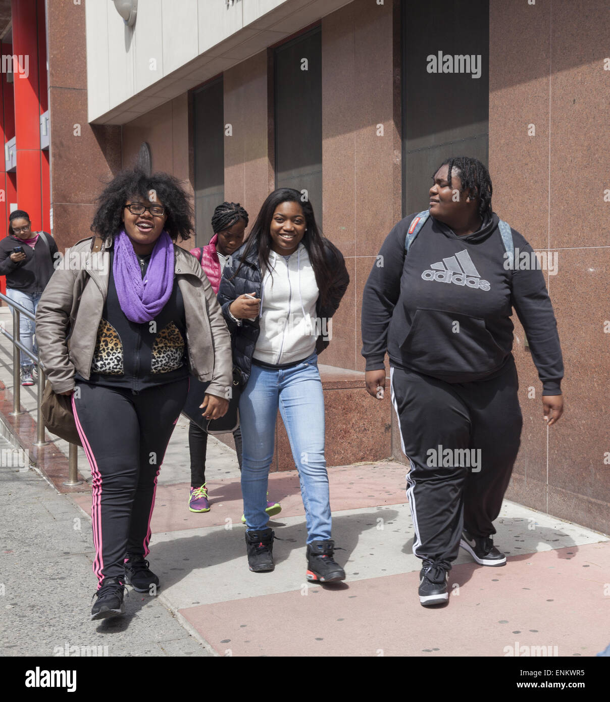 Teenage girls in downtown Brooklyn aftyer school. Many young people are overweight do to poor eating habits. Stock Photo