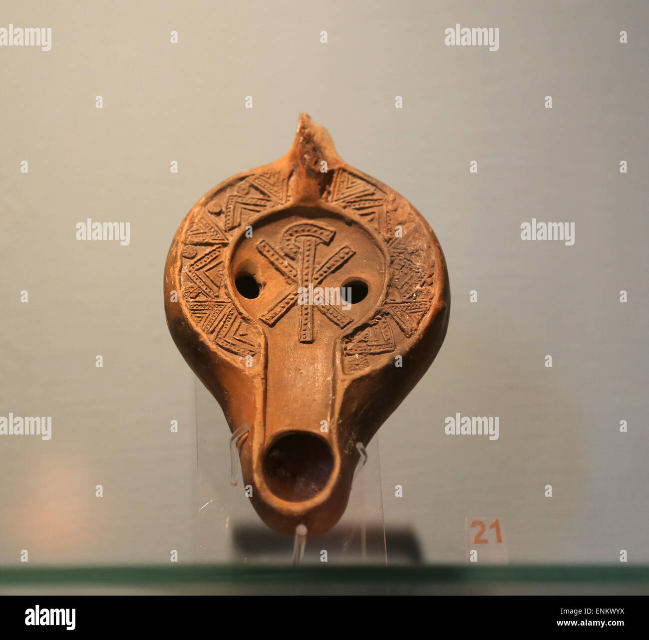 Early Christian. Roman oil lamp. Adorned with Chi Rho symbol. 4th-6th century AD. Vatican Museums. Vatican city. Stock Photo