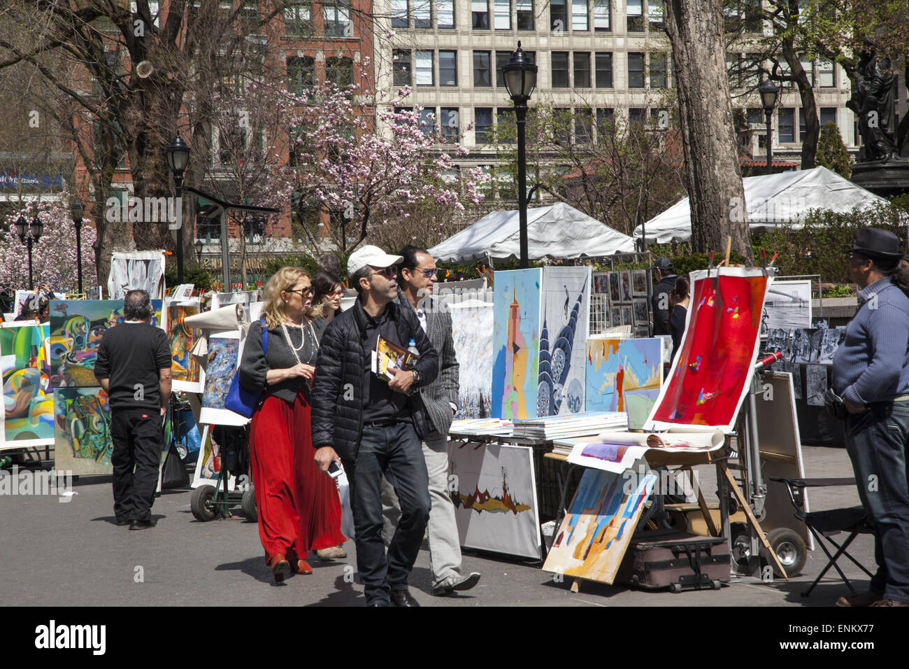 Artists sell their works at the weekly art market along Union Square in Manhattan, NYC. Stock Photo