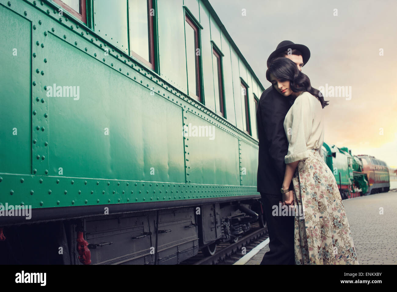 parting of lovely couple on railway station Stock Photo