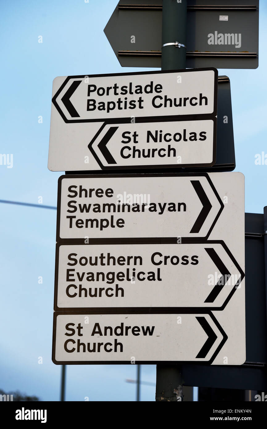 Diverse Religions in the UK with sign posts to baptist Church , Shree Swaminarayan Temple , Evangelical Church in Hove Brighton Stock Photo