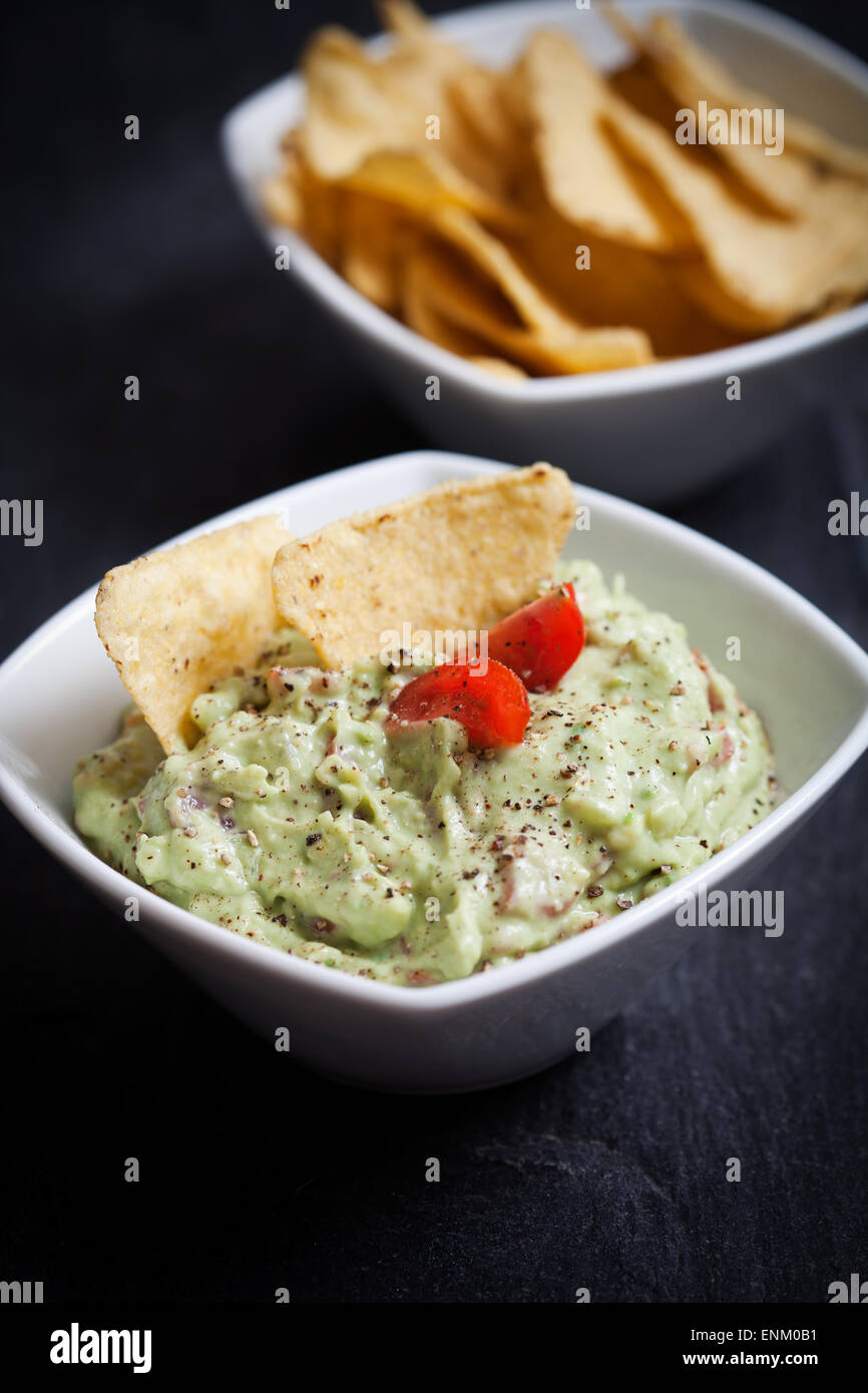 Homemade guacamole with tortilla chips Stock Photo Alamy