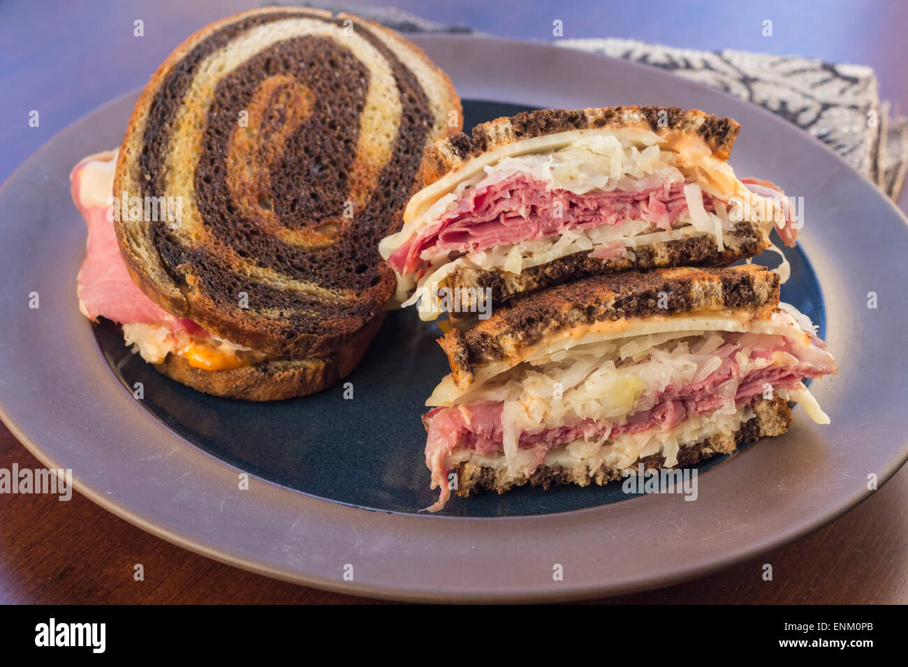 Classic reuben sandwich on pumpernickel swirl rye bread. A hearty meal