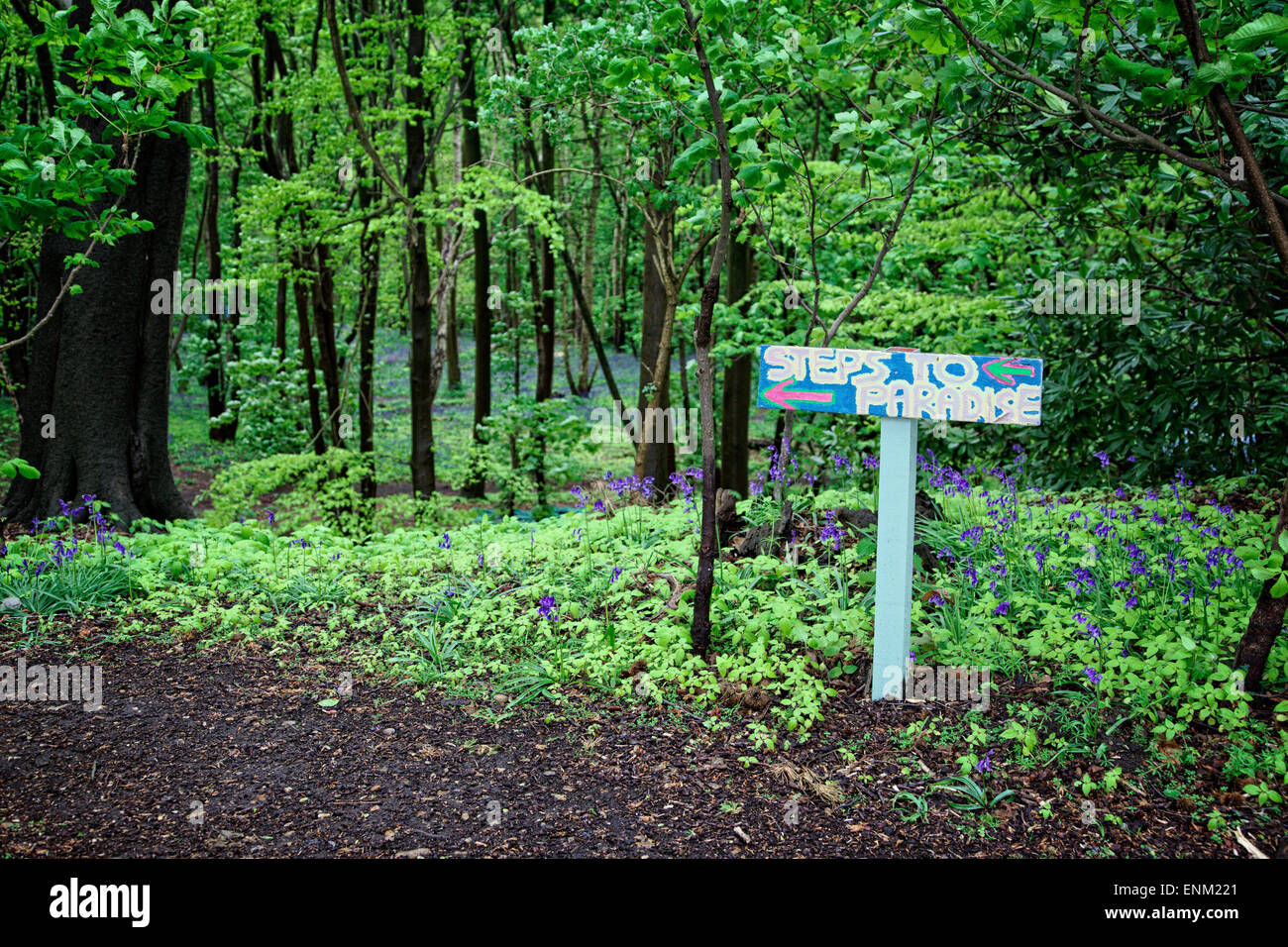 A sign to the 'Eco Village' in Runnymede's woodland set up by an alternative lifestyle community. Stock Photo