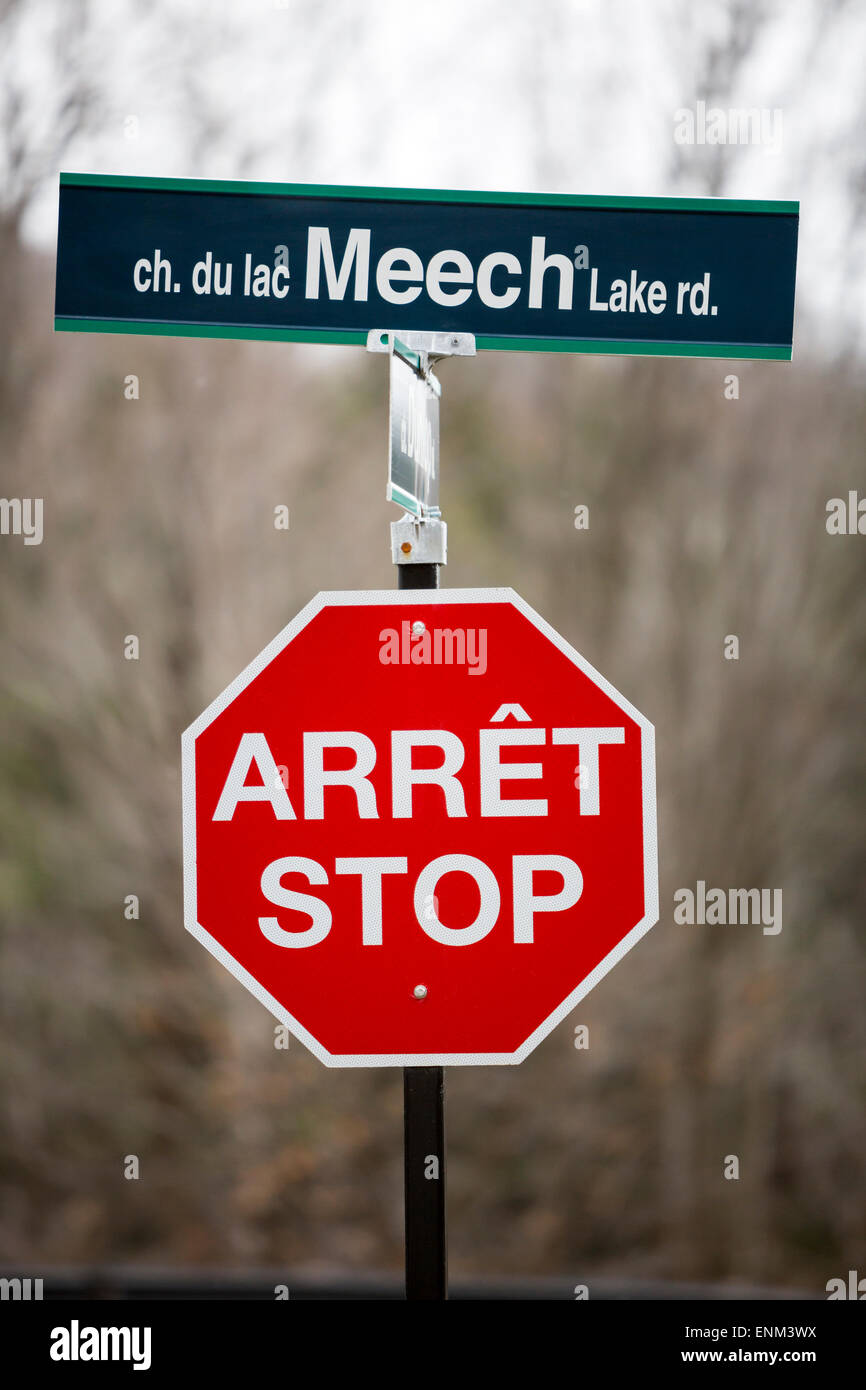 North America, Canada, Quebec, bilingual stop sign and bilingual street sign Stock Photo