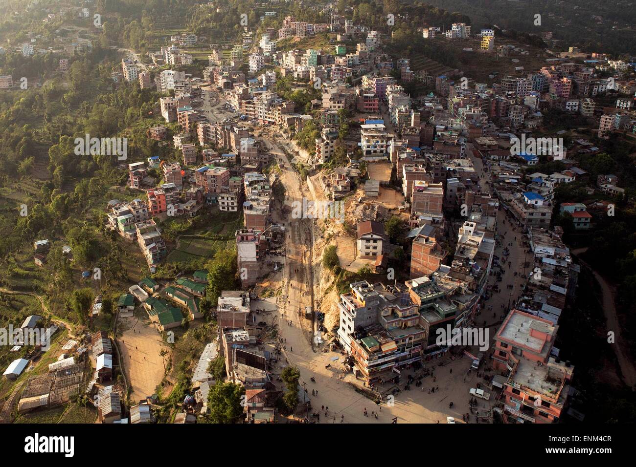 The rubble of homes destroyed by a massive earthquake viewed by a U.S. Marine helicopter during a aid relief mission into remote areas May 5, 2014 in Charikot, Nepal. Stock Photo