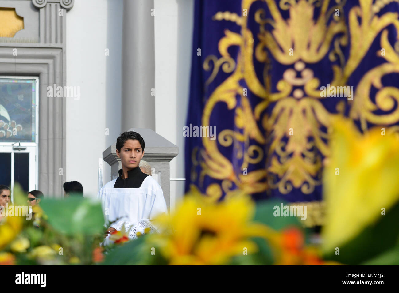 Young boy concentrating before the Good Friday procession in the town of Juana Diaz, Puerto Rico. US territory.Caribbean Island. Stock Photo