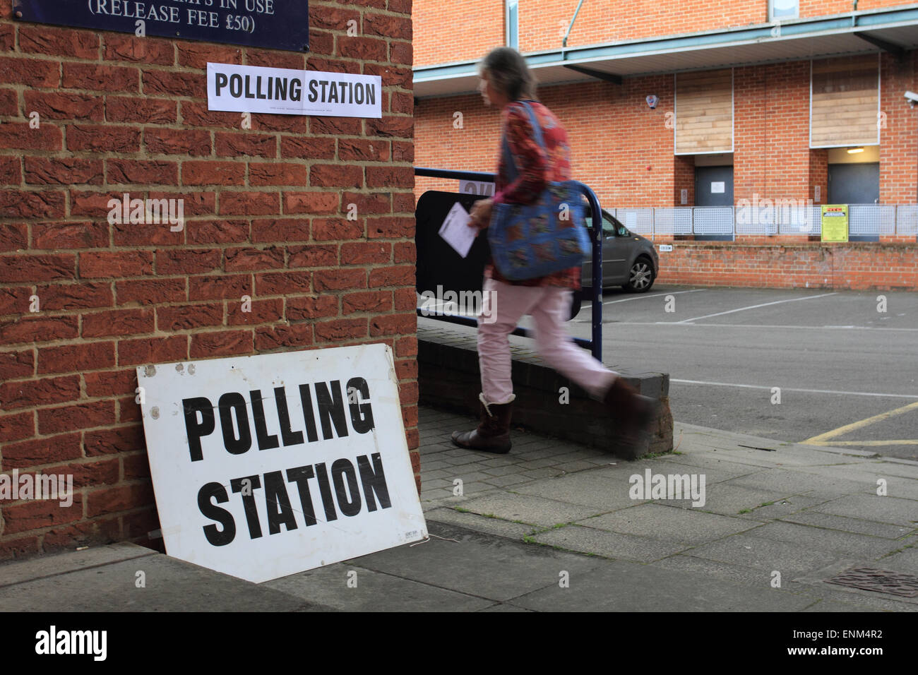 woman walk to Polling station, nationwide General Election in Norwich, Norfolk, UK Stock Photo