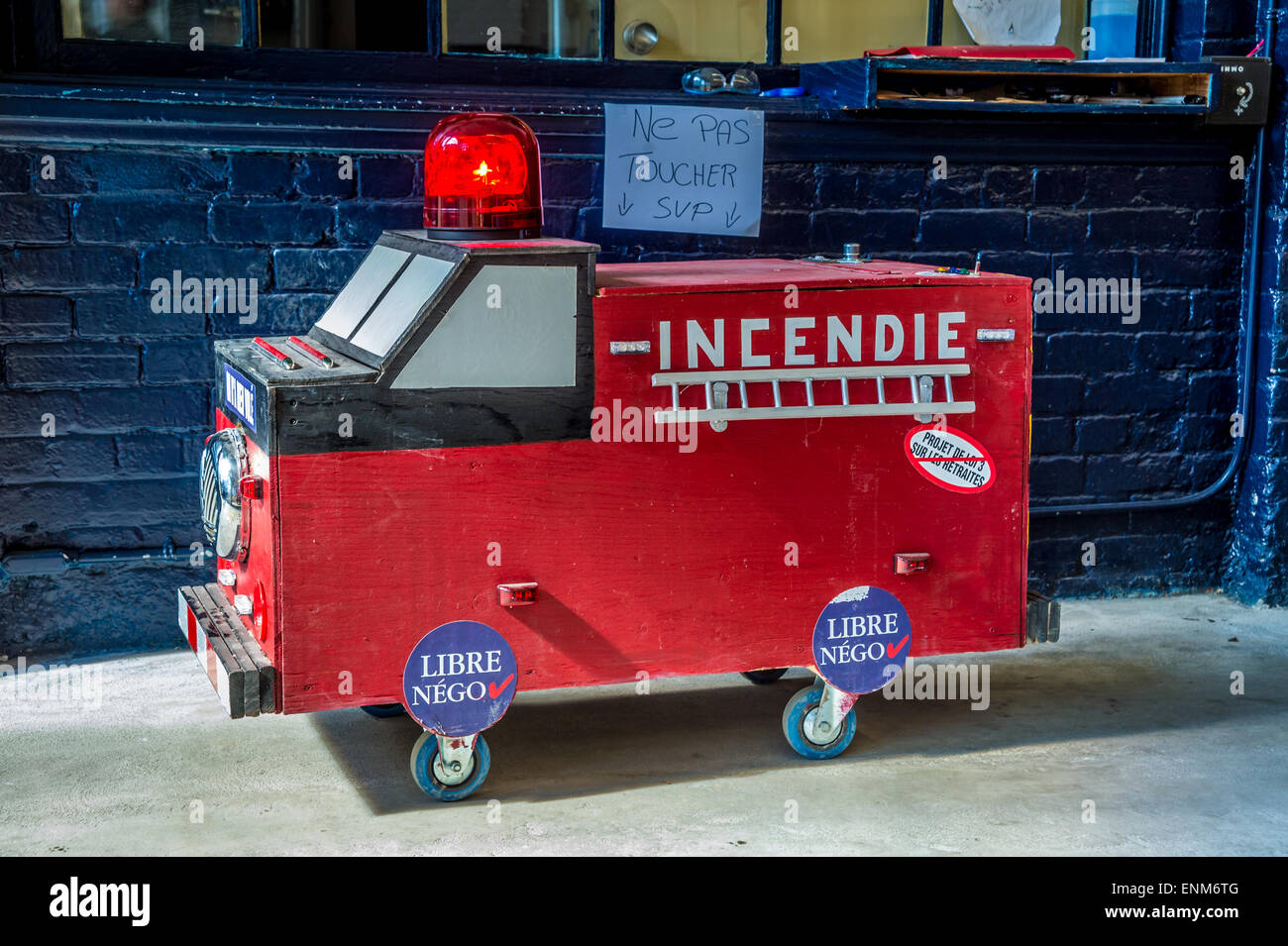 Wooden firetruck symbolizing Montreal firefighters opposing pension reform plan. Stock Photo