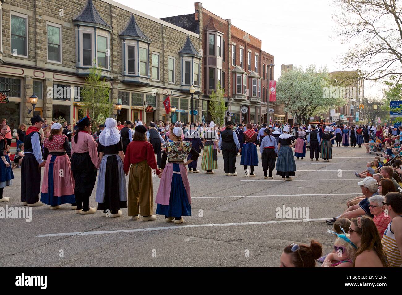 Dancers in traditional Dutch attire line up in the street to perform klompen dancing at Tulip Time in Holland, Michigan Stock Photo