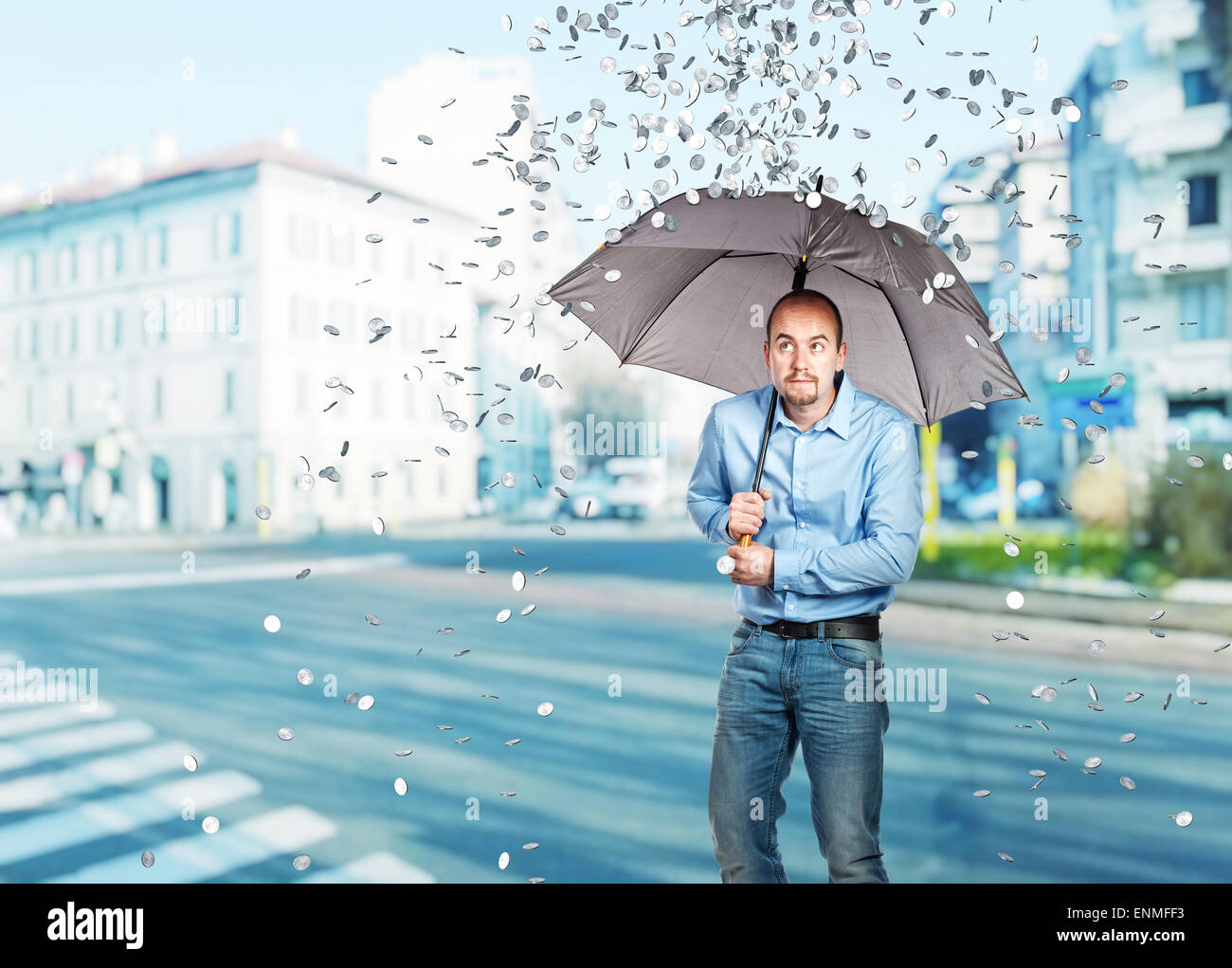 man with umbrella and dollar coin rain Stock Photo