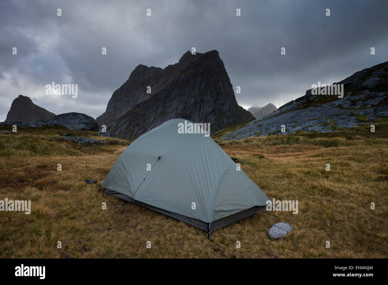 Tent at wild mountain campsite below Kråkhammartind, Moskenesøy, Lofoten Islands, Norway Stock Photo