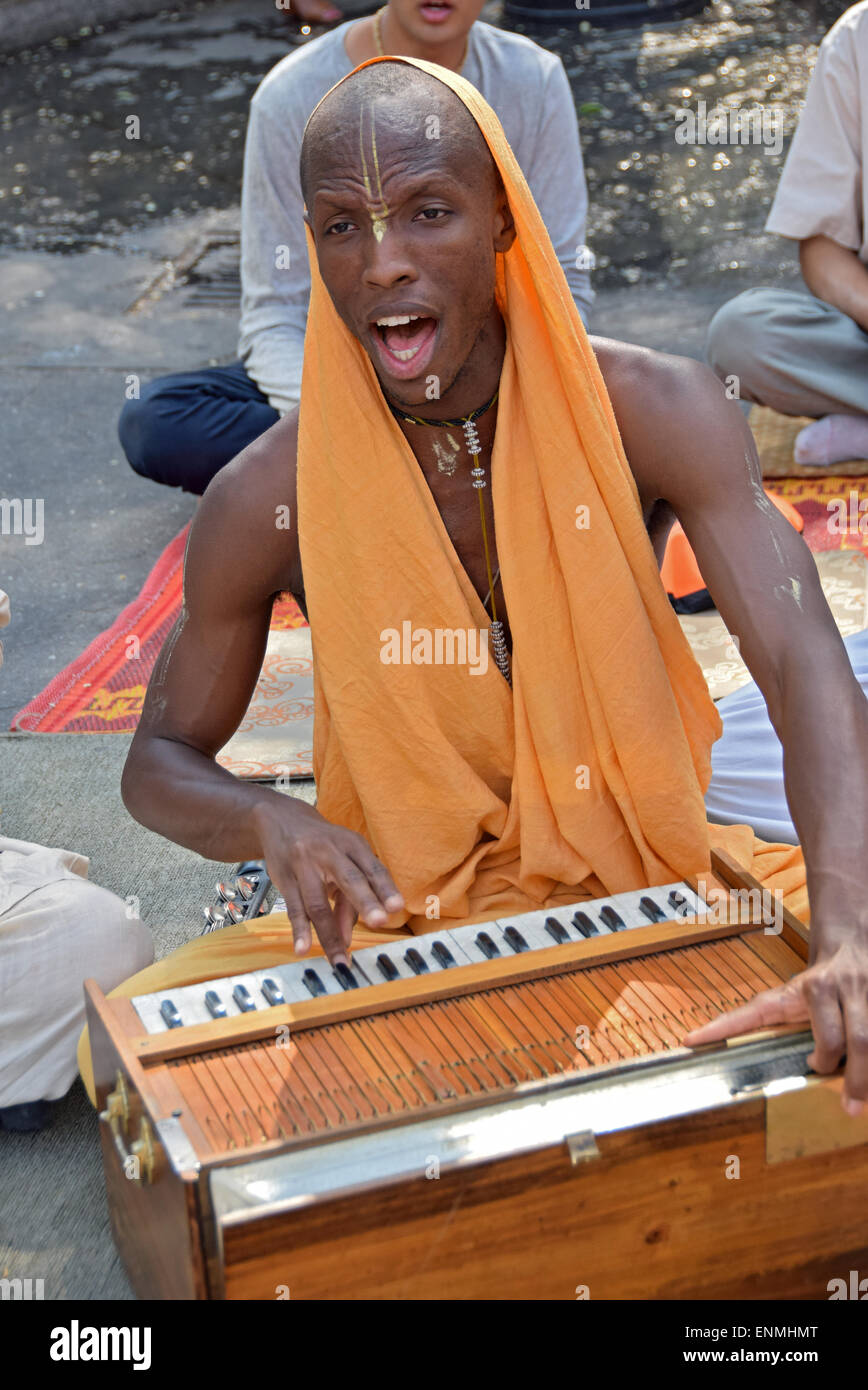 Hare Krisna devotee playing a keyboard in Union Square Park in Manhattan, New York City Stock Photo