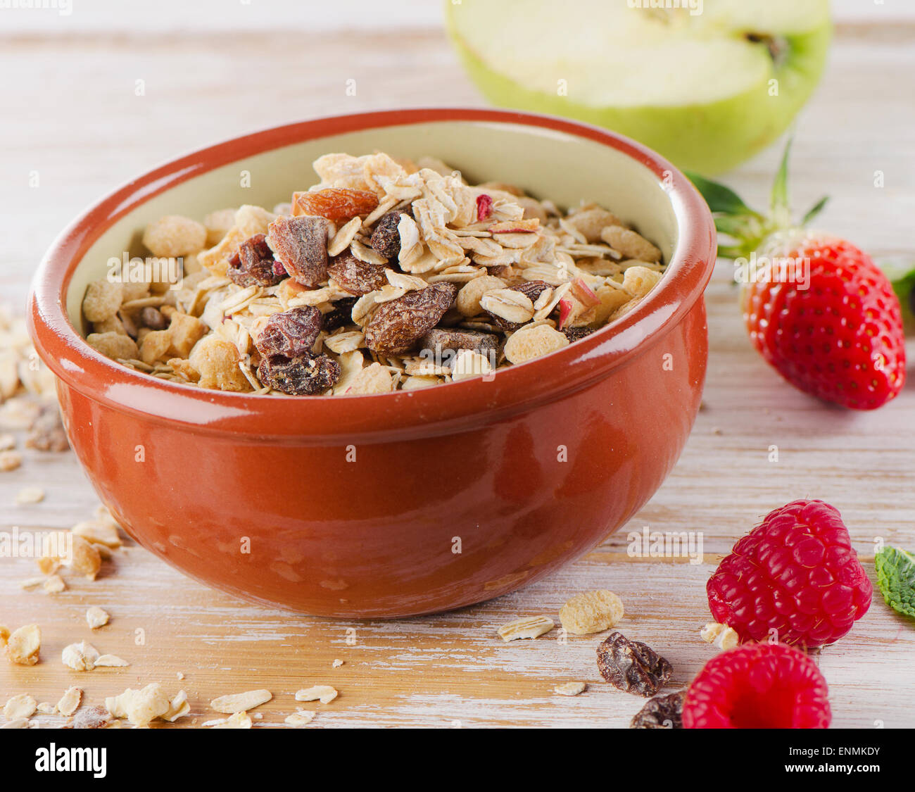 Muesli for breakfast with  berries and green apple . Selective focus Stock Photo