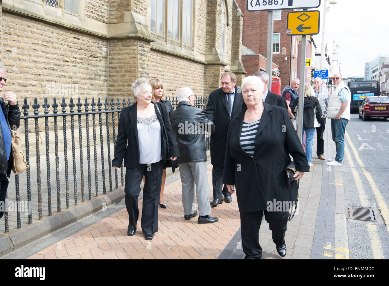 Blackpool, UK. 8th May, 2015. A sad day as the funeral of comic and ventriloquist star Keith Harris takes place at the Sacred heart church on Talbot road Blackpool. Some former fellow stars also attend such as Jimmy Cricket. Some members of the congregation wear a fluorescent green tie in memory of the stars puppet Orville Credit:  Gary Telford/Alamy Live News Stock Photo