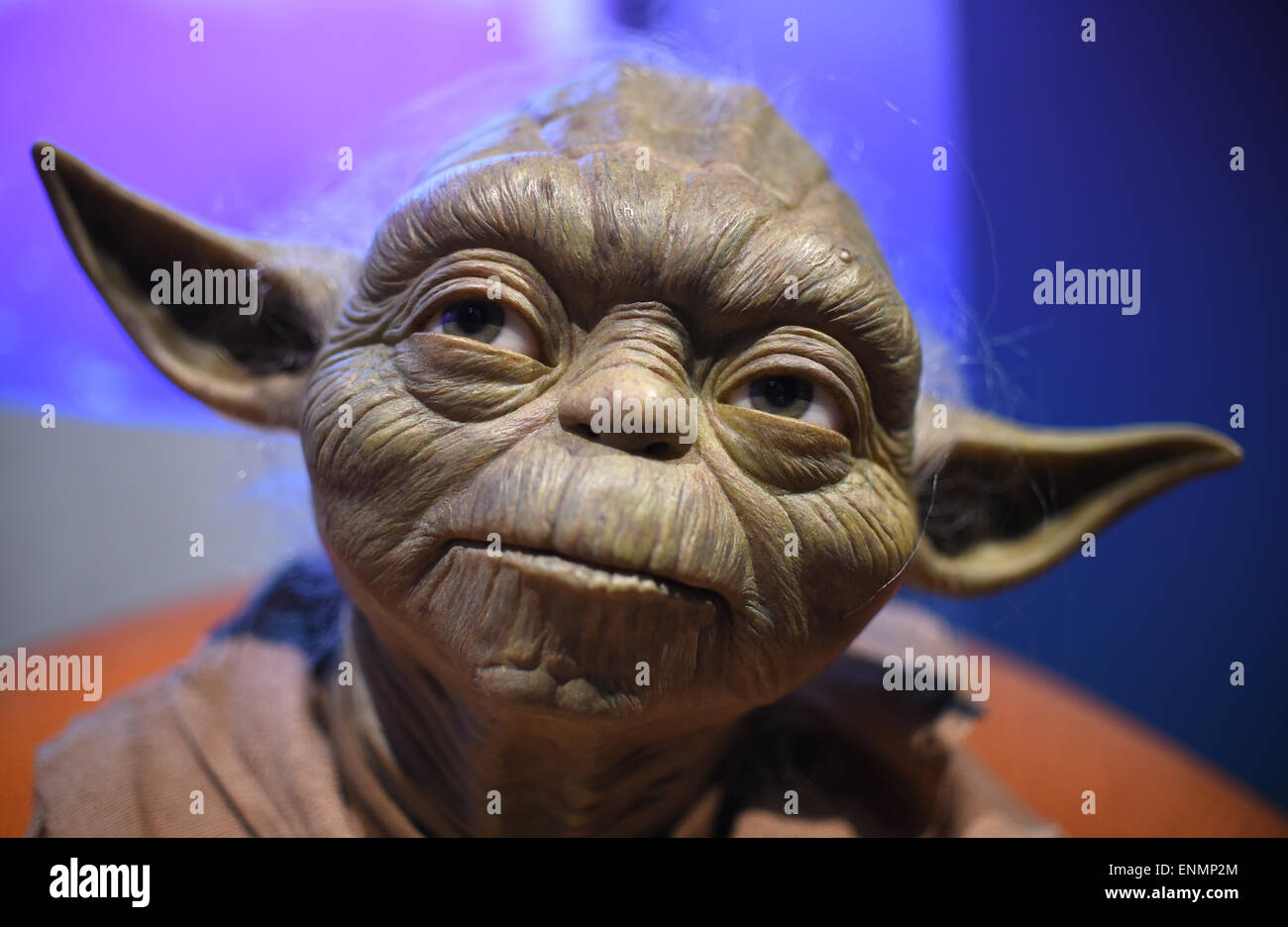 Berlin, Germany. 7th May, 2015. The wax figure of the Star Wars saga 'Yoda' and is on display in preparation for the world premiere exhibition 'Star Wars at Madame Tussauds' at the Madame Tussauds wax museum in Berlin, Germany, 7 May 2015. Eleven figures in three key scenes of the saga will be unveiled on 12 May 2015. Photo: Britta Pedersen/dpa ( IN CONNECTION WITH CURRENT REPORTING)/dpa/Alamy Live News Stock Photo