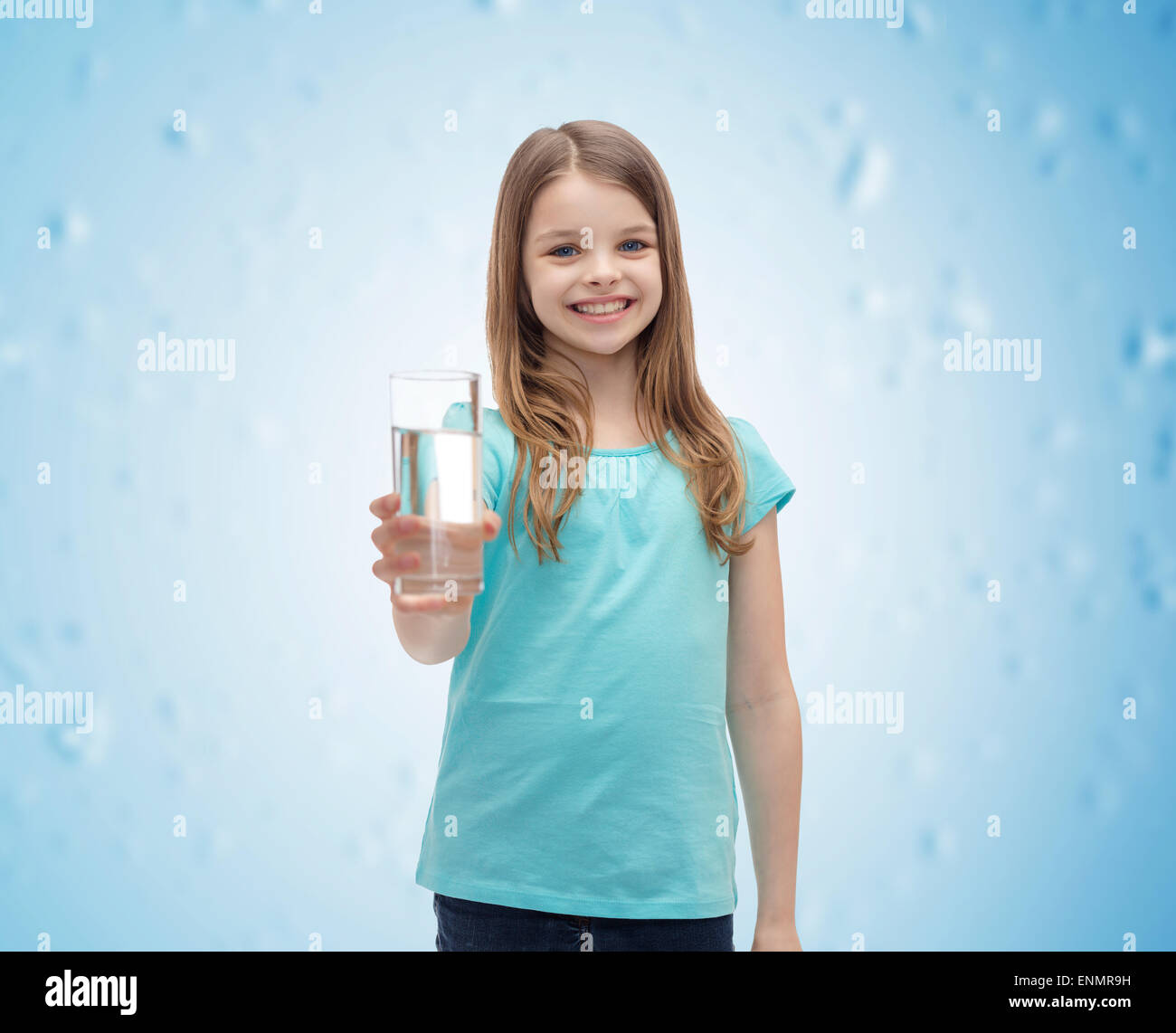 smiling little girl giving glass of water Stock Photo - Alamy