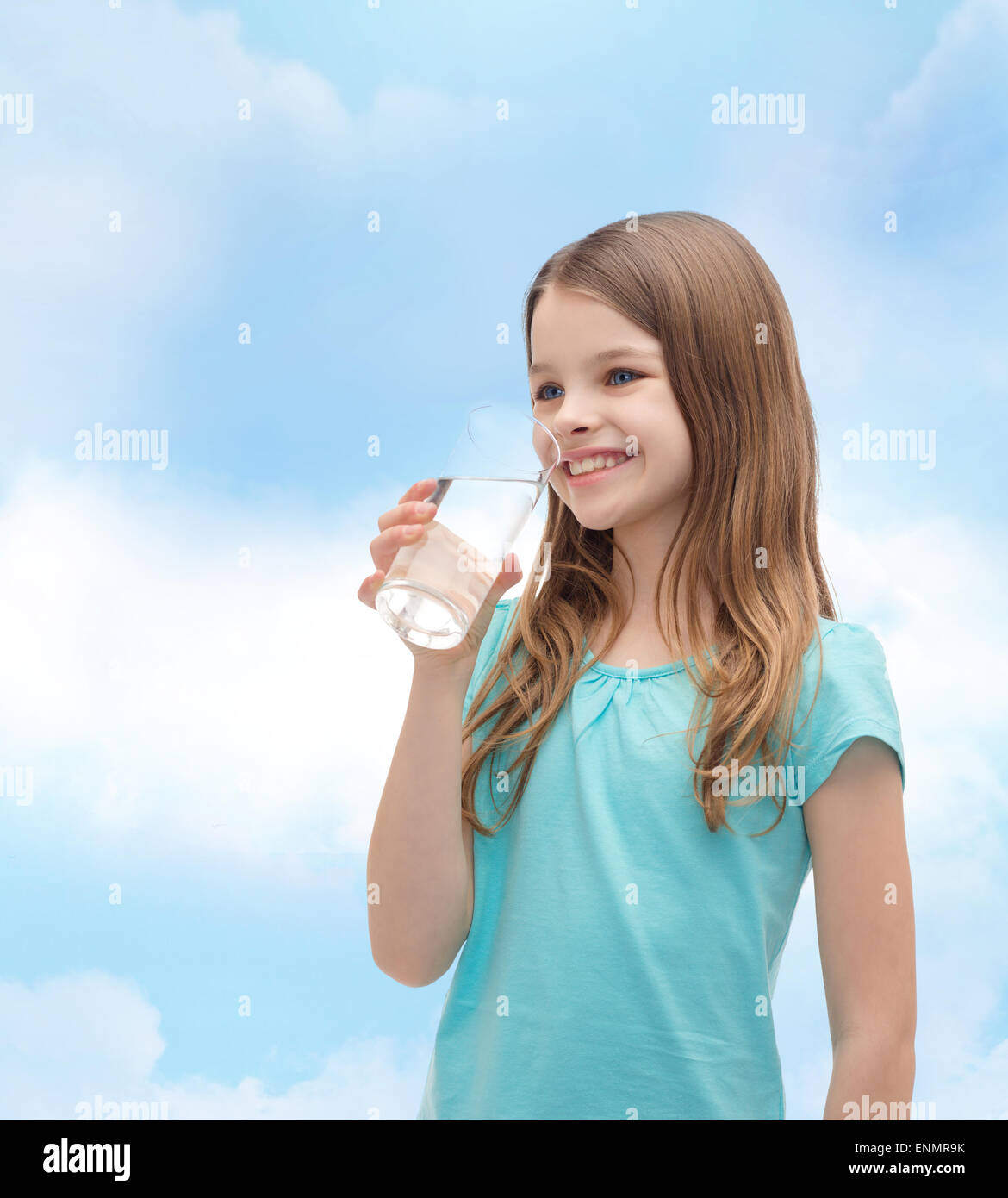 smiling little girl with glass of water Stock Photo - Alamy