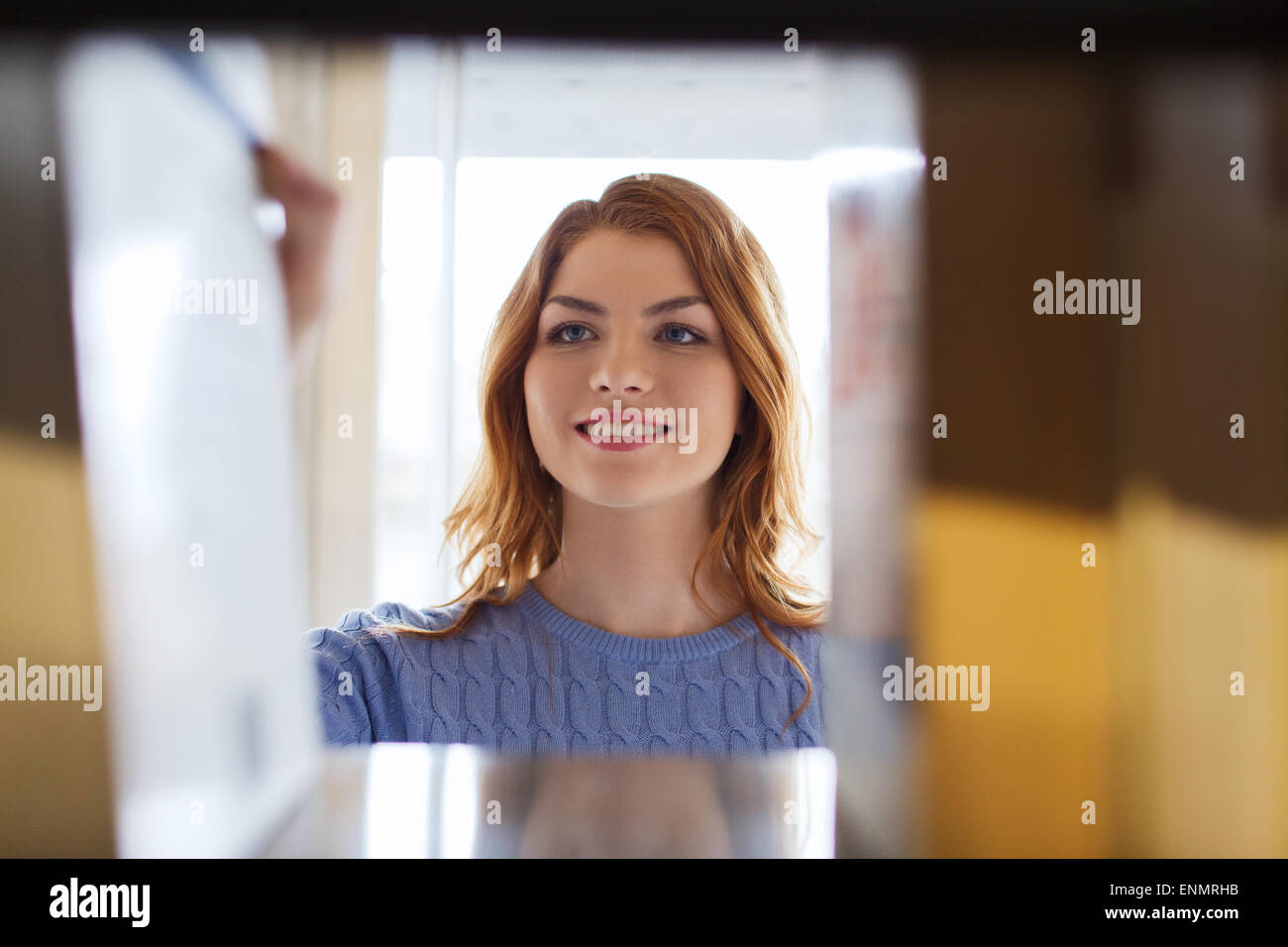 happy student girl or woman with book in library Stock Photo - Alamy