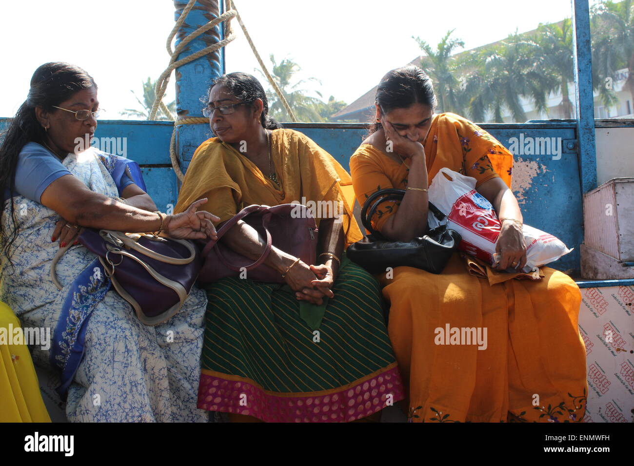Three old ladies sitting on the ferry boat between Fort Cochin and Vypeen Island Stock Photo