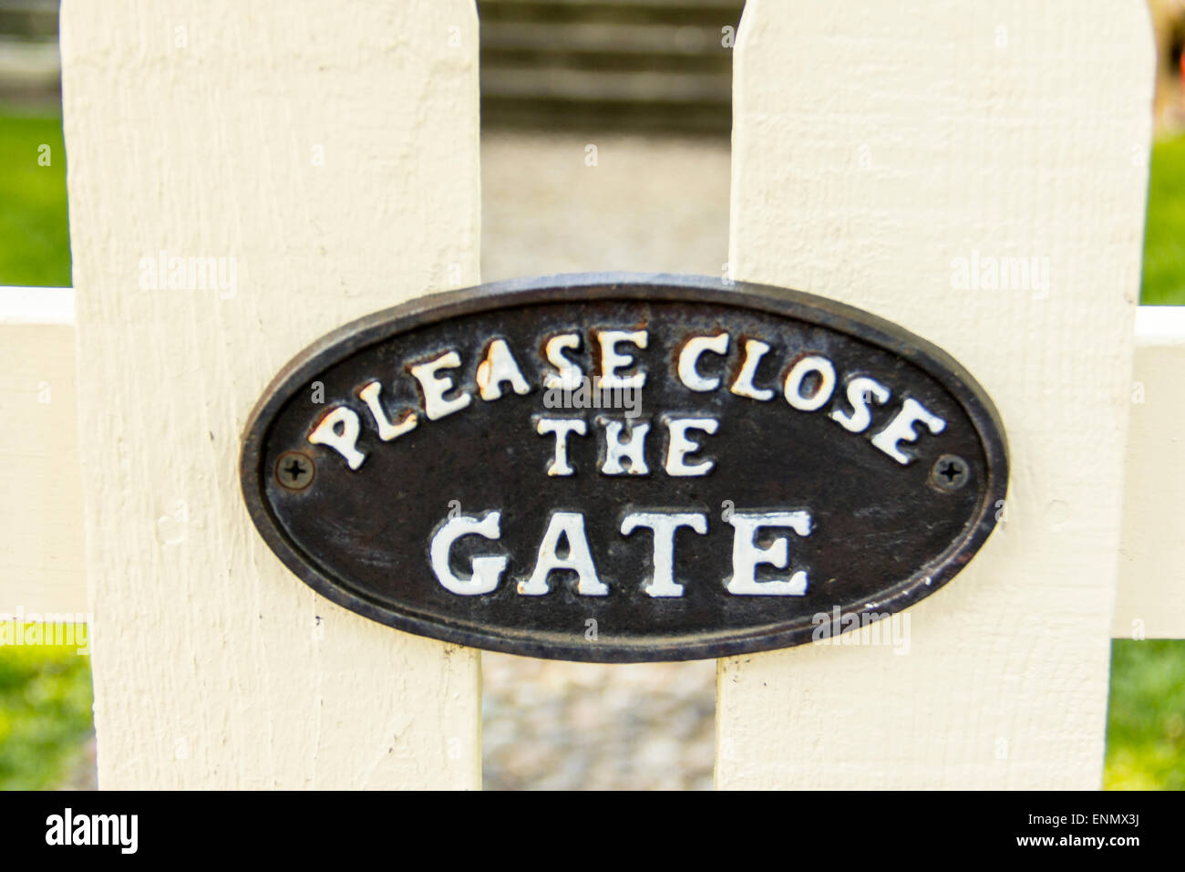 Please Close the Gate sign on a gate . Stock Photo