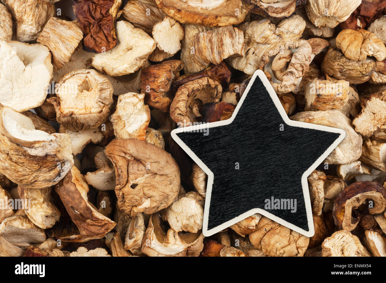 Star, pointer, price, tag, lies on dried mushrooms,  with space for your text Stock Photo