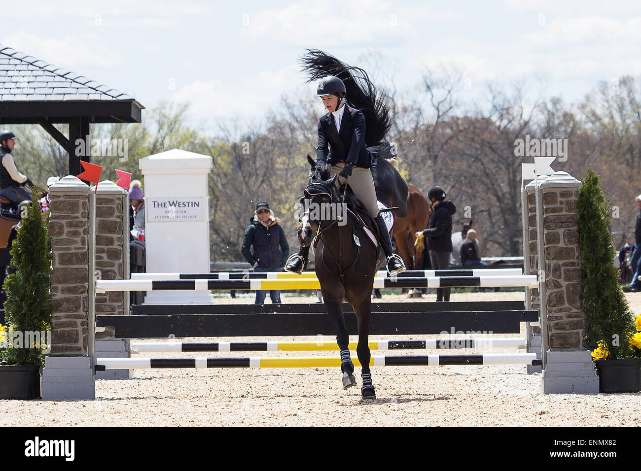 Princeton Equestrian Show Jumping a rider takes her horse over a jump