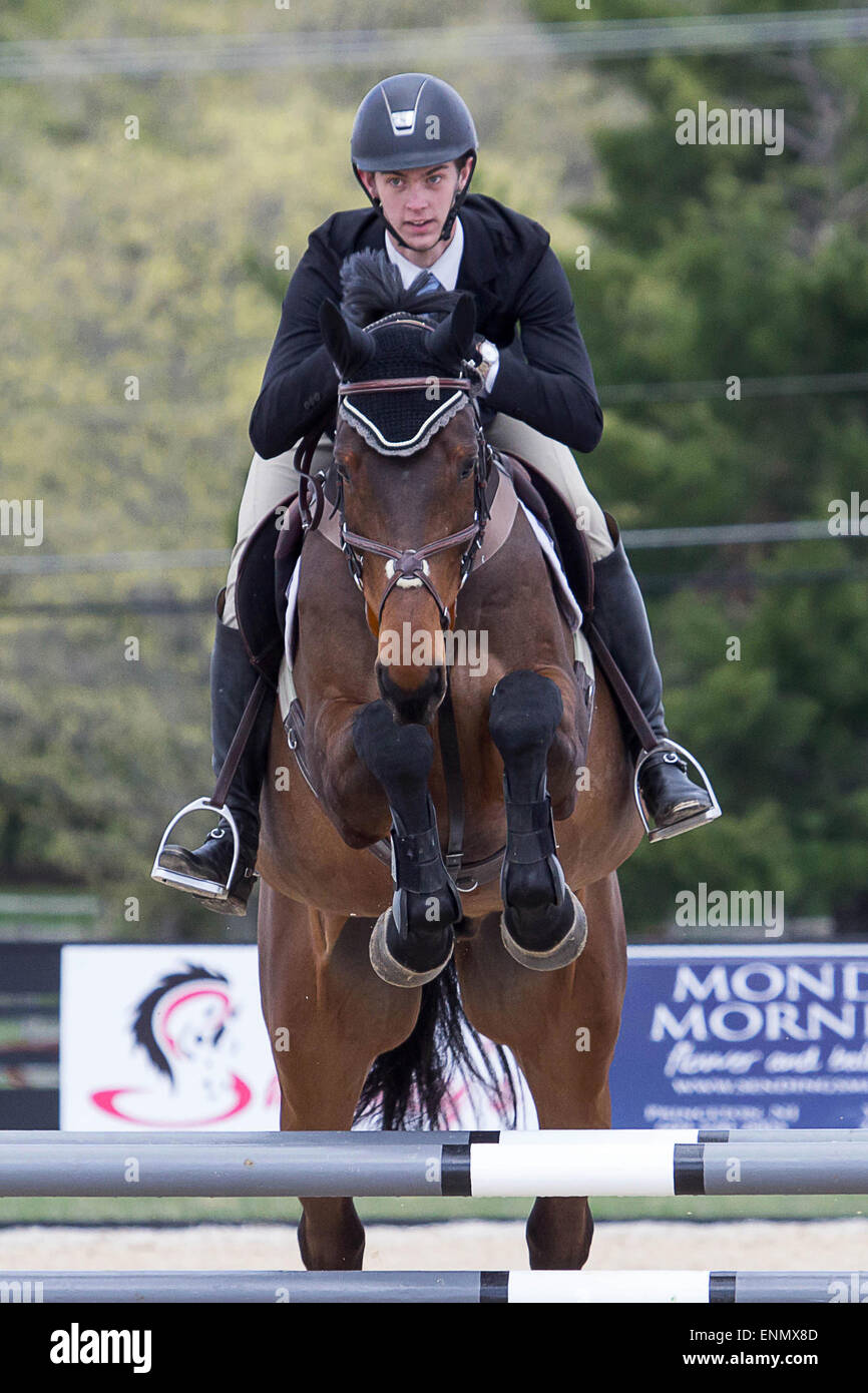 Princeton Equestrian Show Jumping a rider takes his horse over a jump
