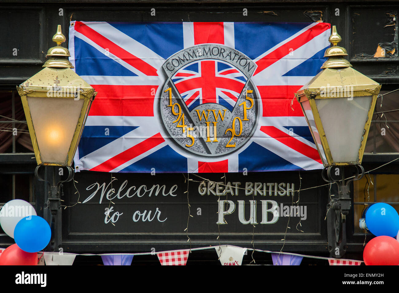 London, UK. 8th May, 2015. A Whitehall pub gets n the spirit. VE Day 70 commemorations - Three days of events in London and across the UK marking historic anniversary of end of the Second World War in Europe. Trafalgar Square, scene of jubilant celebrations marking the end of the Second World War in Europe on 8 May 1945, plays a central part in a host of national events, which include a Service of Remembrance at the Cenotaph, a concert in Horse Guards Parade, a Service of Thanksgiving at Westminster Abbey, a parade of Service personnel and veterans and a flypast. Credit:  Guy Bell/Alamy Live N Stock Photo