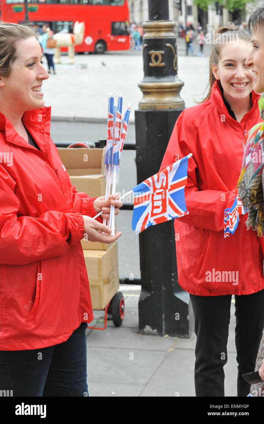 Whitehall, London, UK. 8th May 2015. People from the Sun newspaper handing out free Union Jack flags. VE Day celebrations take place in London. Credit:  Matthew Chattle/Alamy Live News Stock Photo