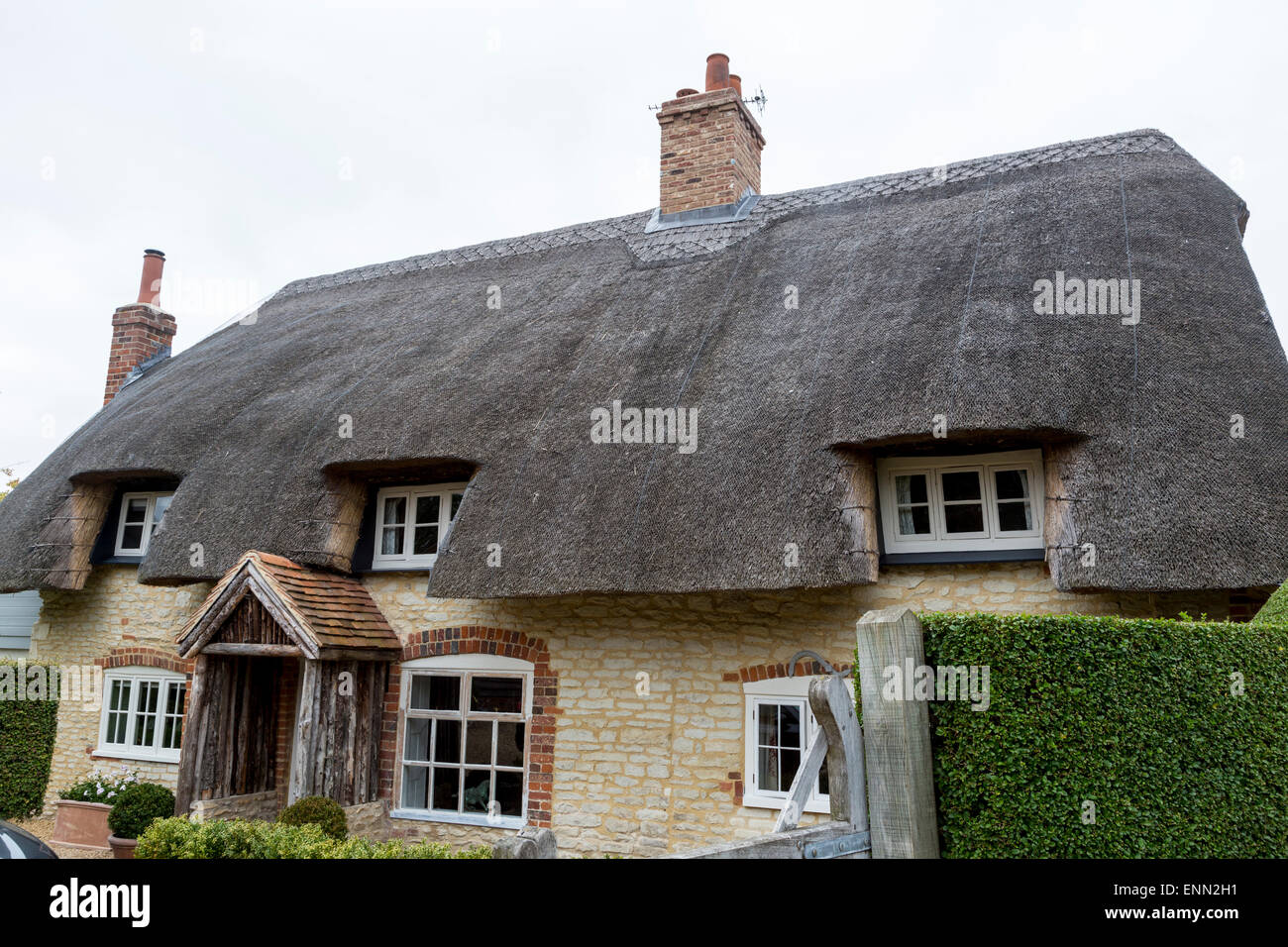 UK, England, Ewelme.  Thatched Roof on an English Cottage. Stock Photo