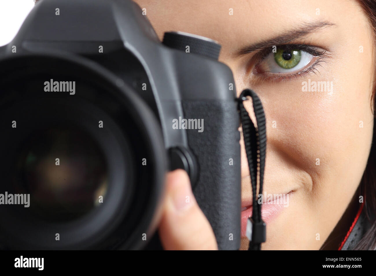 Close up of front view of a photographer woman eye photographing with a dslr camera Stock Photo