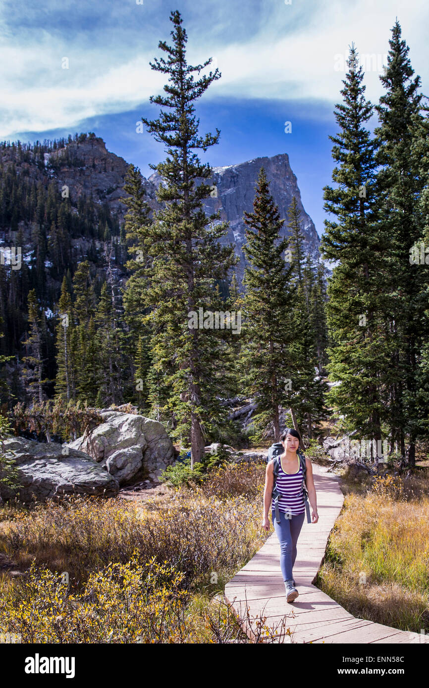 Young Female Hiking in the mountains Stock Photo