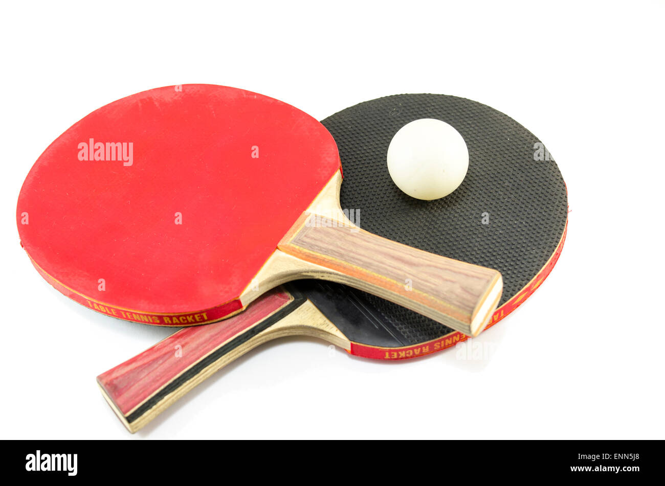 Two ping-pong rackets and a ball isolated on white Stock Photo