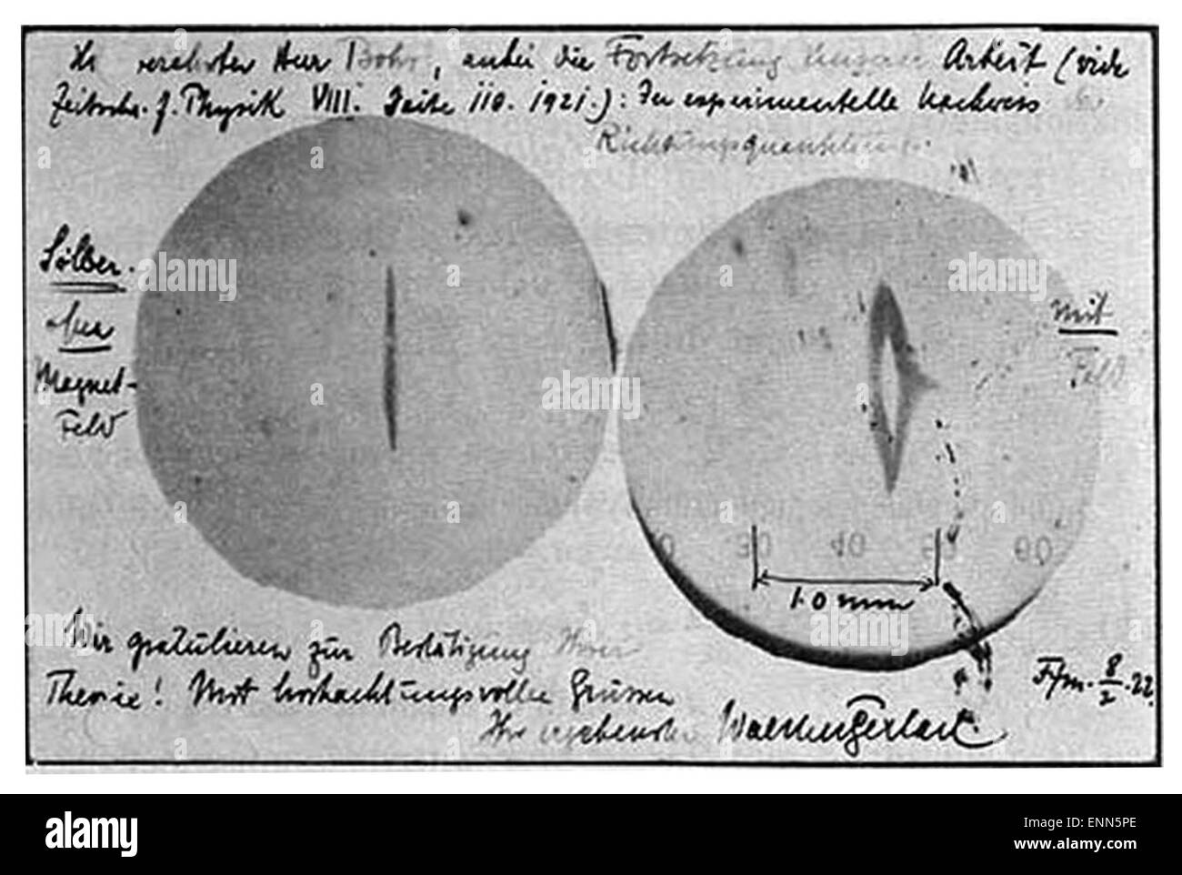Postcard sent from Walther Gerlach to Niels Bohr on February 8 1922 shows a photograph of the beam splitting.  The message reads: '“....the experimental proof of directional quantisation. We congratulate you on the confirmation of your theory....” Stock Photo