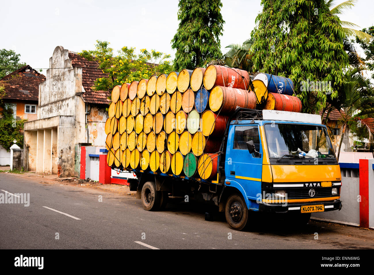 A truck fully stacked with colourful barrels in Fort Kochi. Stock Photo