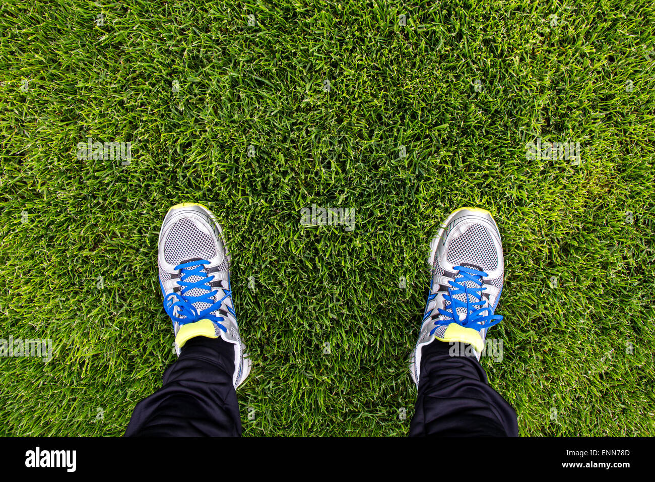 Running shoes on a green grass Stock 