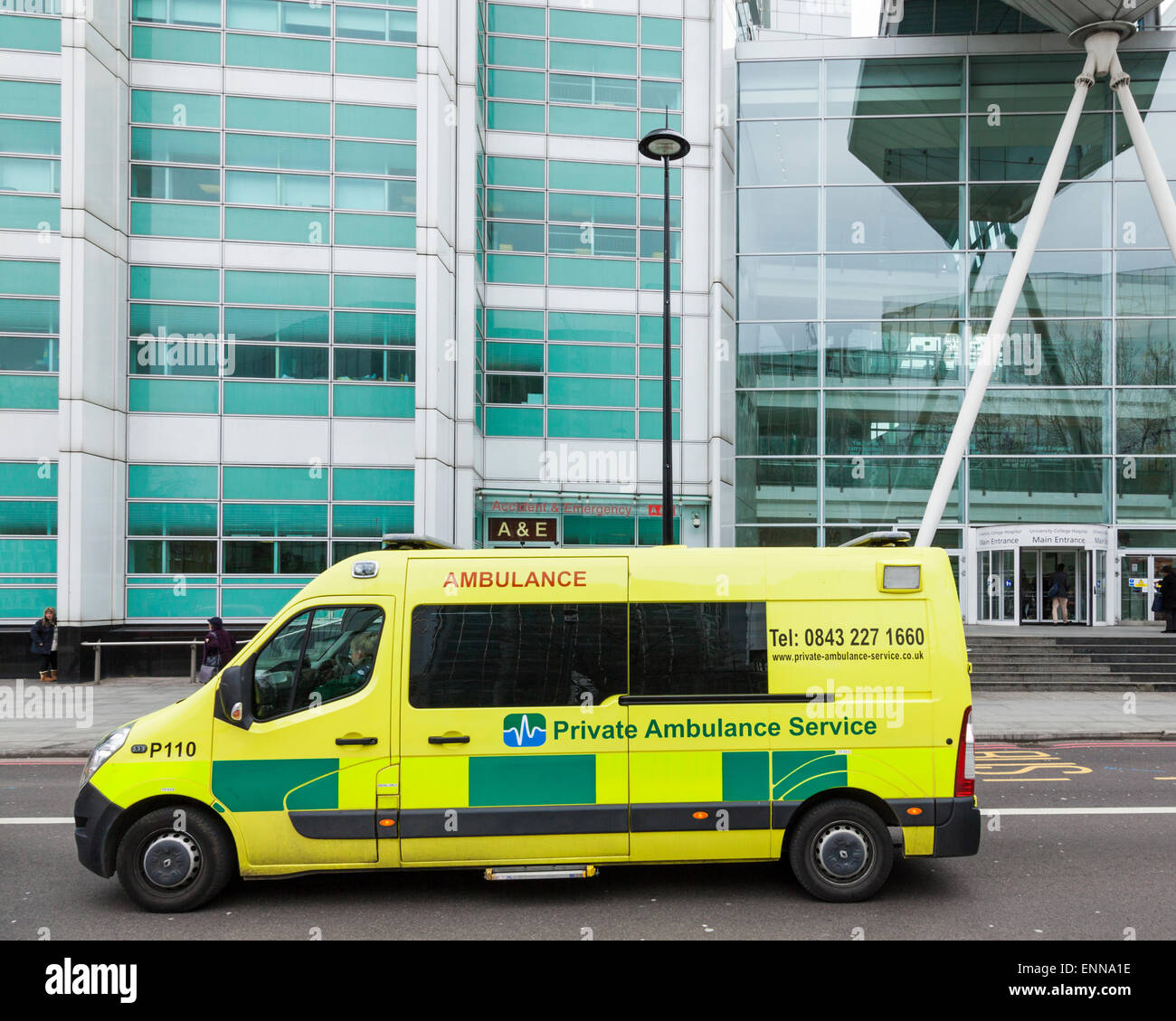 Private ambulance travelling past University College Hospital, London