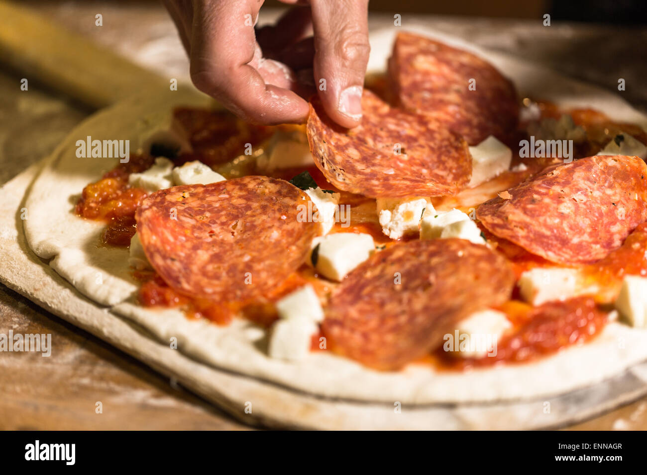 Making Napolitana Style Pizza in Italian restaurant. Stock Photo