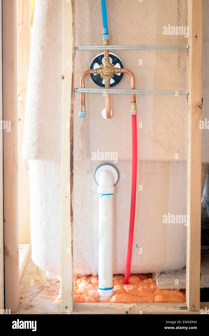 Exposed shower plumbing in new construction Stock Photo Alamy